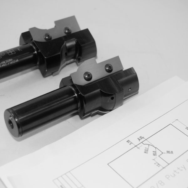 Precision engineered black hydraulic cylinder assemblies with mounting brackets and technical blueprint specifications